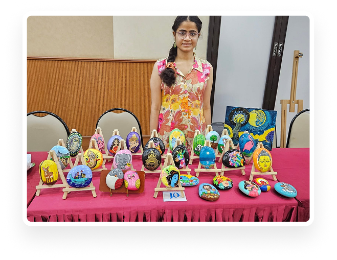 Nehal with her hand-painted stone artwork